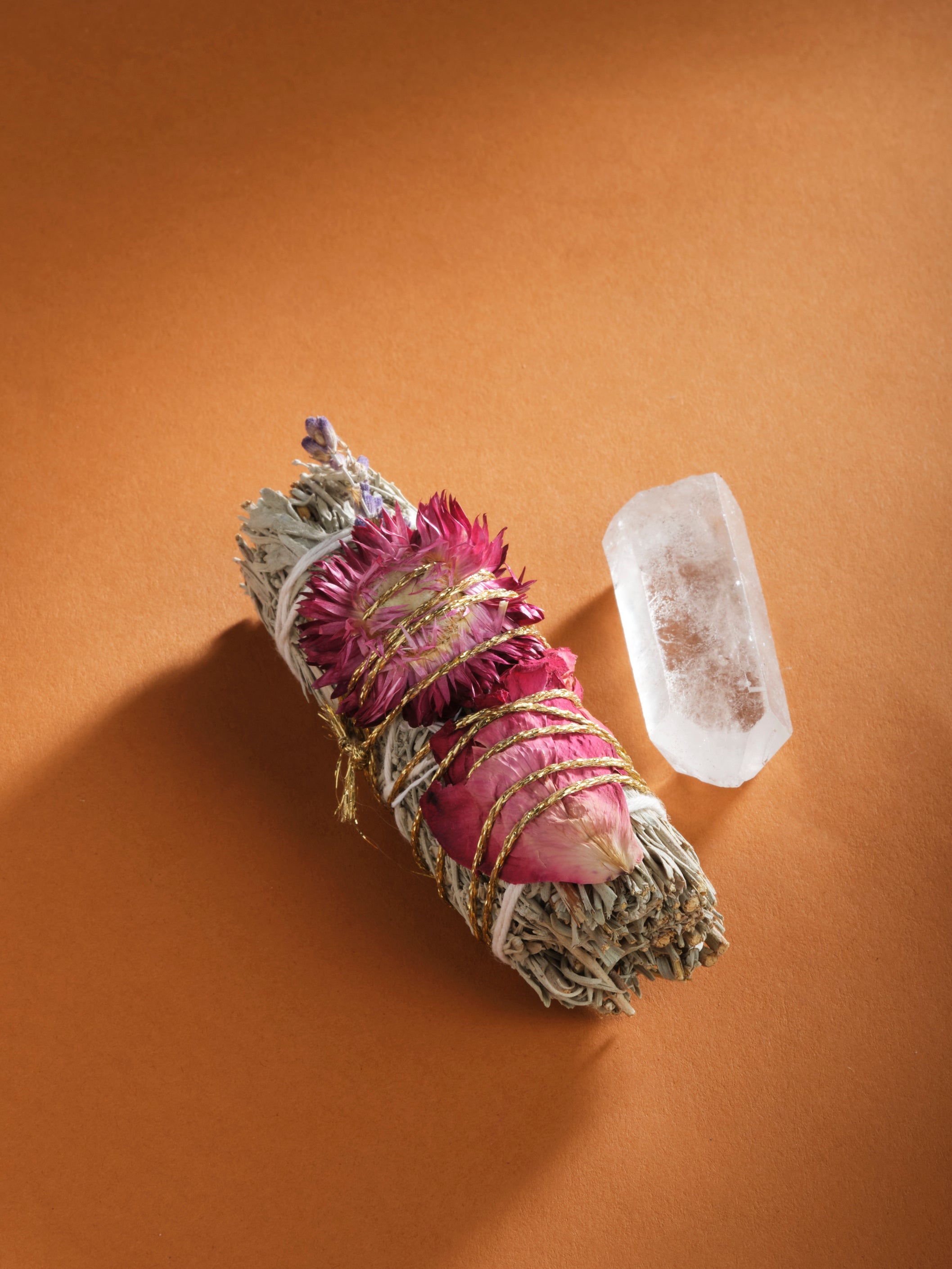 A bundle of desert blue sage and a clear quartz crystal are featured in the product image for "Release & Revitalize" from My Healing Kit.